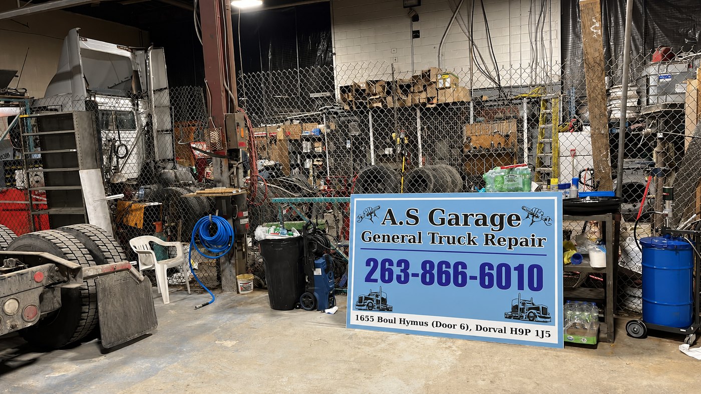 Inside A.S Garage General Truck Repair — our workshop and shop sign in Dorval, QC